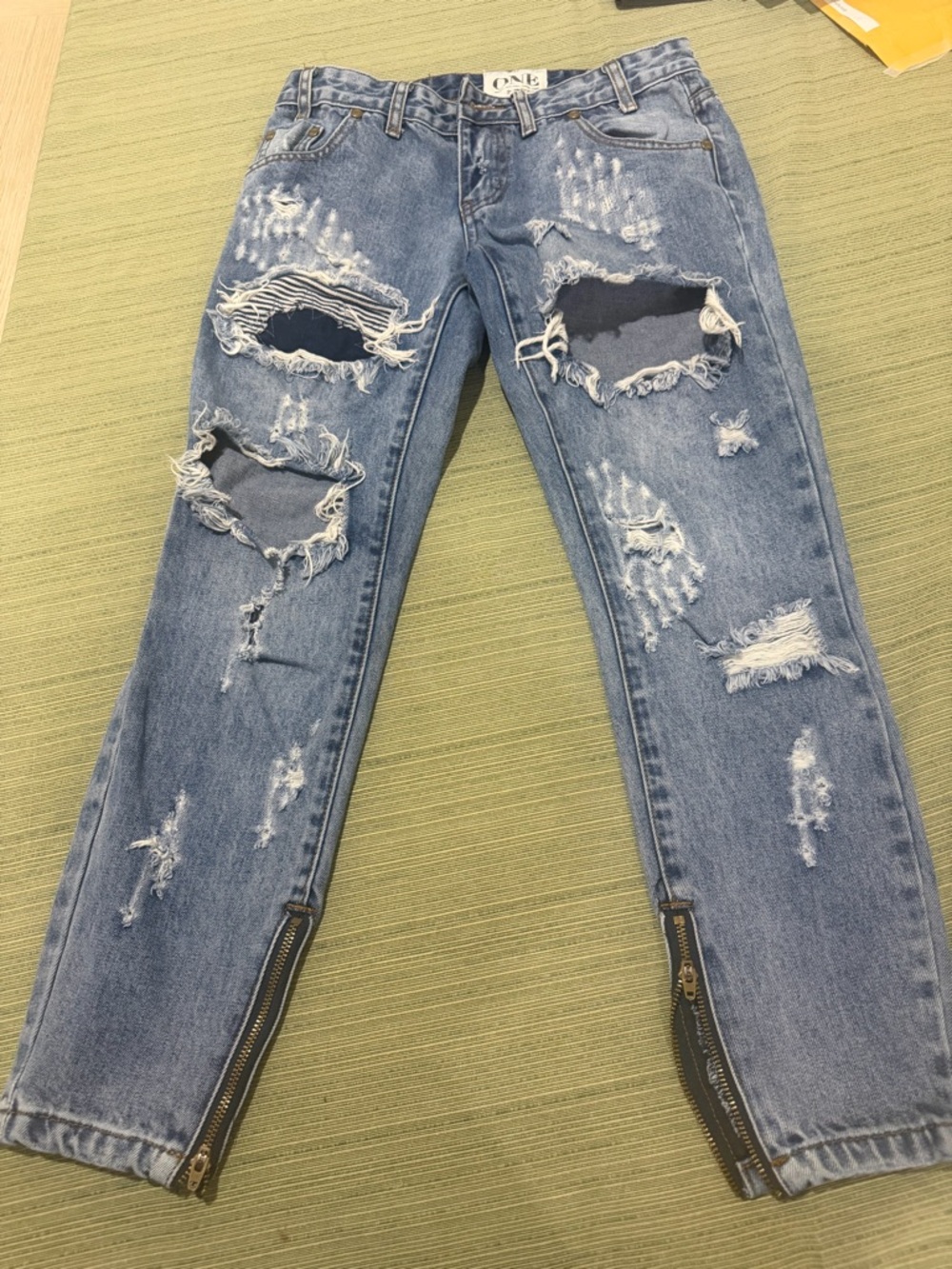 Distressed Light Blue Skinny Jeans with Ankle Zips by